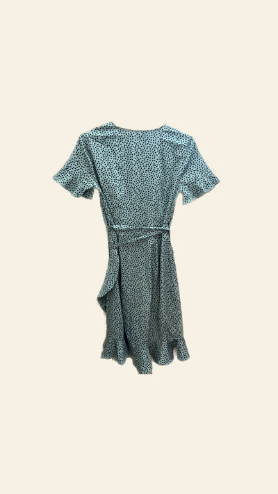 Green wrap around sundress with ruffles.